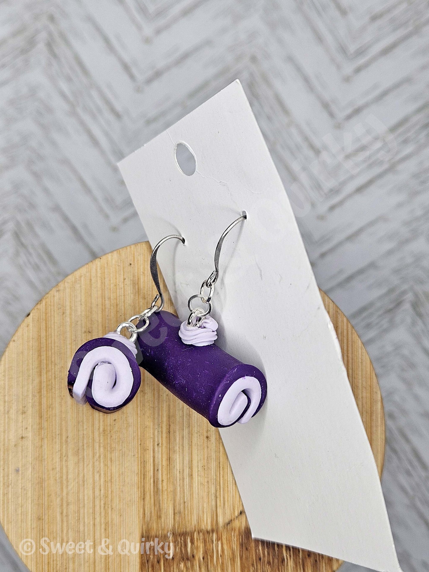 Purple and lavender swirled ube inspired food earrings.