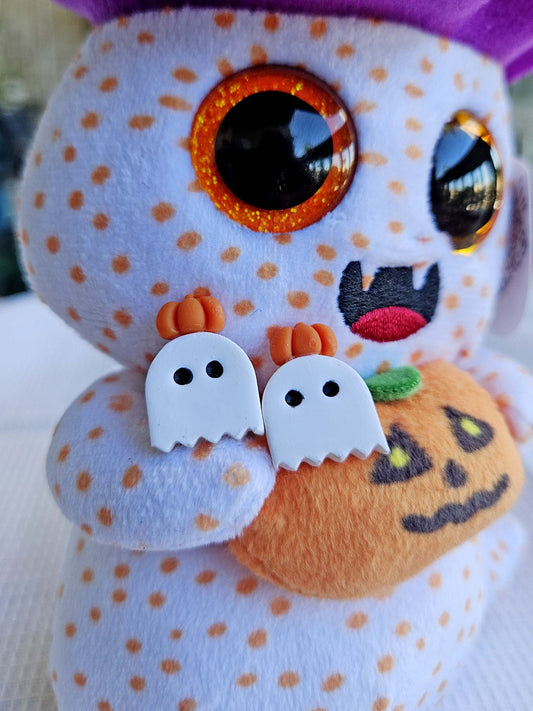 Halloween-themed plush toy with polka dot pattern, ghost and pumpkin decorations.