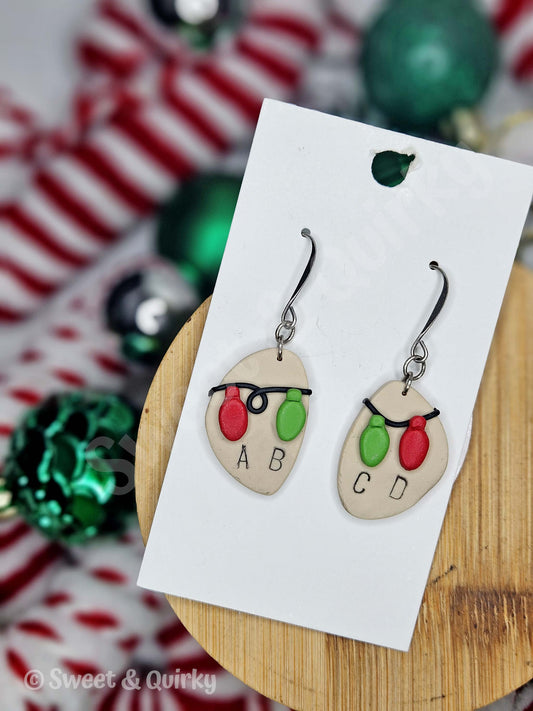 Christmas-themed earrings on a card with festive background