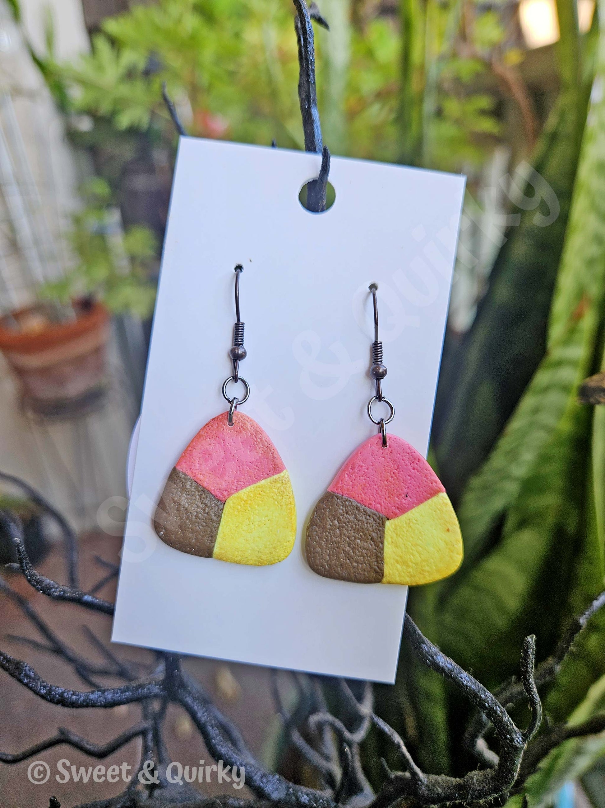 Triangle shaped cookie earrings on hooks.